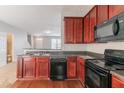 Kitchen with stainless steel sink, dishwasher, and hardwood floors at 4217 High Park Ln, Atlanta, GA 30344