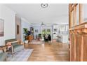 Open-concept living space featuring hardwood floors and seamless flow into the kitchen at 2505 Midway Rd, Decatur, GA 30030