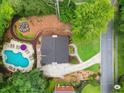 Stunning aerial view of a home with a pool, water feature, and beautifully landscaped grounds at 4250 Green Ridge Dr, Marietta, GA 30062