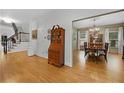 Open living space with hardwood floors, staircase, and doorway to the formal dining room at 4250 Green Ridge Dr, Marietta, GA 30062