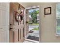 Open front door with wreath and a view to the outdoors at 2336 Heritage Park Nw Cir # 11, Kennesaw, GA 30144