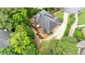 Aerial view of home's deck with patio seating and landscaped backyard at 130 Silver Mist Cir, Alpharetta, GA 30022