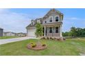 Attractive two-story home featuring a manicured lawn, and attached garage in a suburban neighborhood at 247 Arnewood Cir, Mcdonough, GA 30253
