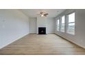 Spacious living room with hardwood floors and a cozy fireplace at 247 Arnewood Cir, Mcdonough, GA 30253