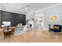 Bright living room featuring a decorative fireplace, hardwood floors, and contemporary furnishings at 1363 Jonesboro Se Rd, Atlanta, GA 30315