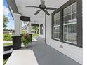 Inviting porch with stylish black and white trim, ceiling fan, and ample natural light at 1363 Jonesboro Se Rd, Atlanta, GA 30315