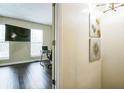 Modern home office with dark wood floors, large window, and sleek desk, perfect for remote work at 3302 Waldrop Trl, Decatur, GA 30034