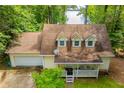 Inviting home with a front porch, attached garage, and beautiful landscaping at 9018 Lakeview Pkwy, Villa Rica, GA 30180