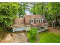 Inviting home with a front porch, attached garage, and beautiful landscaping at 9018 Lakeview Pkwy, Villa Rica, GA 30180