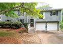 Attractive two-story home with attached two car garage and manicured front lawn at 1140 Reading Nw Dr, Acworth, GA 30102