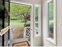 A view through the front door with a glimpse of the landscaped front yard at 1140 Reading Nw Dr, Acworth, GA 30102