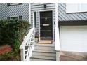 Close up of the front door with a decorative door knocker and a Welcome mat at 1140 Reading Nw Dr, Acworth, GA 30102