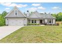Charming single-Gathering home with a manicured lawn, two-car garage, and inviting curb appeal at 2241 N 16 Hwy, Whitesburg, GA 30185