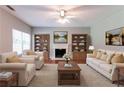 Comfortable living room with fireplace, built-in bookshelves, and plush seating at 5018 Upper Elm St, Atlanta, GA 30349