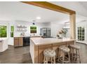 Bright, modern kitchen features an island with seating and stainless steel appliances at 5315 Bentley Hall Dr, Alpharetta, GA 30005