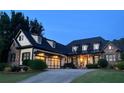 Beautiful home showcasing dark shutters, stylish garage doors, and professional landscaping at 154 Gold Leaf Trail Trl, Powder Springs, GA 30127