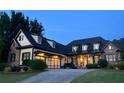 Lovely home boasting stone accents, a well-manicured lawn and a two-car garage at 154 Gold Leaf Trail Trl, Powder Springs, GA 30127