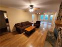 Cozy living room with a stone fireplace and hardwood floors at 3054 Whisper Knob Rd, Marietta, GA 30062