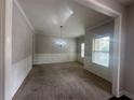 Elegant dining room featuring stylish chandelier and wainscoting at 443 Strawberry Walk, Loganville, GA 30052