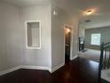 Inviting entry featuring hardwood floors and an arched display nook at 443 Strawberry Walk, Loganville, GA 30052