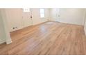 Bright living room featuring hardwood flooring, freshly painted walls, and natural light at 705 Stewart Nw Cir, Marietta, GA 30064