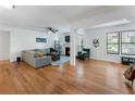 Inviting living room with hardwood floors, a cozy fireplace, and an abundance of natural light at 1274 Branch Dr, Tucker, GA 30084