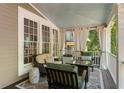 Relaxing covered porch with comfortable seating, privacy curtains, and stylish outdoor decor at 22 The Prado Ne, Atlanta, GA 30309