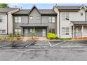 Well-maintained townhome exterior with reserved parking and manicured green spaces at 1516 Howell Mill Nw Rd # 16, Atlanta, GA 30318