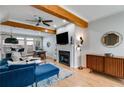 Inviting living room with fireplace, hardwood floors, and a modern ceiling fan at 1516 Howell Mill Nw Rd # 16, Atlanta, GA 30318