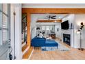 Bright living area with hardwood floors, fireplace, and access to a staircase at 1516 Howell Mill Nw Rd # 16, Atlanta, GA 30318