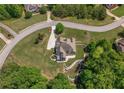 Expansive rear view of property with stone terracing, lush greenery, and a private backyard at 893 Somersby Dr, Dallas, GA 30157