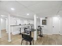 Finished basement with bar area, perfect for entertaining guests and relaxing in a stylish space at 2436 Ovidia Sw Cir, Atlanta, GA 30311