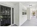 Welcoming entryway with a freshly painted brick facade with a black door, creating a bright, clean aesthetic at 2436 Ovidia Sw Cir, Atlanta, GA 30311