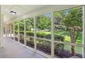 Relaxing screened porch with views of the landscaped yard, offering a peaceful outdoor living space at 2436 Ovidia Sw Cir, Atlanta, GA 30311