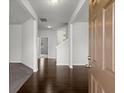 Inviting home foyer with hardwood floors leading into the living spaces at 5575 Mirror Lake Dr, Cumming, GA 30028