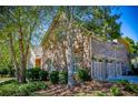 Brick home featuring a three-car garage and well-maintained landscaping, blending elegance and functionality at 197 Westbrook Rd, Carrollton, GA 30116