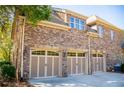 Spacious three-car garage with brick exterior, offering ample parking and storage at 197 Westbrook Rd, Carrollton, GA 30116