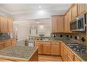 Spacious kitchen with stainless appliances, granite countertops, and an island at 5003 Village Terrace Dr, Dunwoody, GA 30338