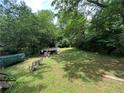 Spacious backyard with mature trees and greenery, perfect for outdoor activities at 861 Marion Se Ave, Atlanta, GA 30312