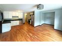 Modern kitchen with stainless steel appliances, white cabinets, and hardwood floors creating an inviting atmosphere at 861 Marion Se Ave, Atlanta, GA 30312