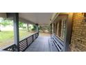 A covered front porch with a built-in bench offers an inviting space to relax at 2035 Northland Dr, Lawrenceville, GA 30044