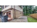 Side view of the home with a two car garage at 2035 Northland Dr, Lawrenceville, GA 30044