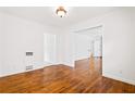 Hardwood floors with neutral walls that lead to other areas of the home at 3211 Hollydale Drive Sw, Atlanta, GA 30311