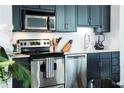 Close-up of kitchen featuring stainless steel appliances and white countertops at 620 Glen Iris Dr # 223, Atlanta, GA 30308