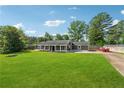 Lovely one-story home with a spacious front yard and ample parking space at 3280 Pebble Hill Dr, Marietta, GA 30062