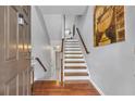 Inviting foyer with hardwood floors and staircase leading upstairs, filled with natural light at 630 Birch River Ln, Lawrenceville, GA 30043