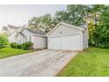 The property includes a spacious two-car garage and concrete driveway at 6304 Kendra Ln, Lithonia, GA 30058