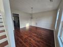 Elegant dining area featuring hardwood floors, a chandelier, and ample natural light at 1857 Oak Hill Springs Blvd, Lithonia, GA 30058