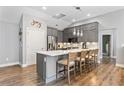 Modern kitchen with stainless steel appliances, a center island with seating, and stylish pendant lighting at 406 Genevieve Dr, Canton, GA 30114