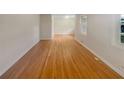Bright hallway featuring gleaming hardwood floors, fresh paint, and an open layout at 2584 Favor Sw Rd, Marietta, GA 30060